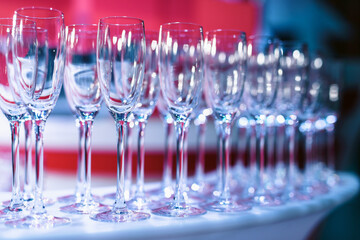 Set or row glasses of wine on the table before reception or wedding party