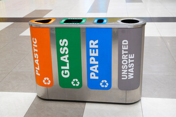 Recycling of garbage separation and recycling concept. Colorful bins for different garbage with...
