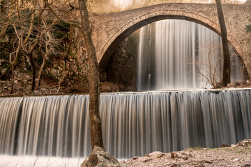 The double waterfalls and the stone bridge of Paleokaria, in Greece.