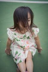 Happy Asian toddler in the park.