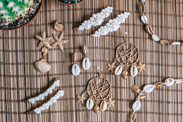 Pearl, Seashell, Beads Accessories on Natural Bamboo Background