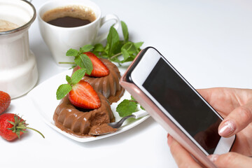 Chocolate fudge garnished with half a strawberry with petals. Garnished with sprigs of mint and...