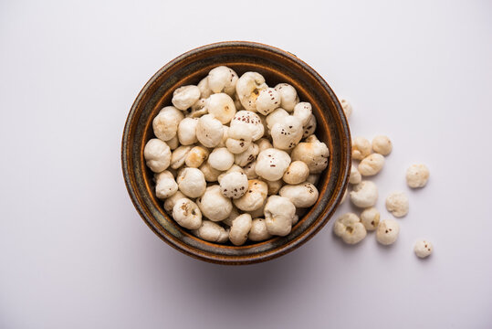 Makhana, also called as Lotus Seeds or Fox Nuts are popular dry snacks from India, served in a bowl. selective focus
