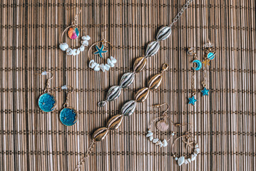 Pearl, Seashell, Beads Accessories on Natural Bamboo Background