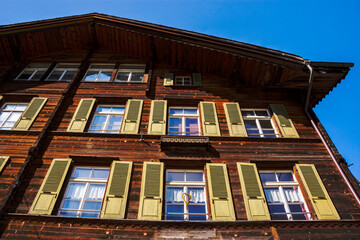 Fototapeta na wymiar House facade in Lauterbrunnen swiss village , Jungfrau region, Bernese Oberland, Switzerland. 