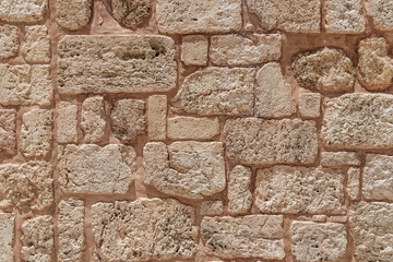 View of surface of the stone wall of the masonry of Jerusalem stones