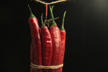 fresh organic peppers on a black background