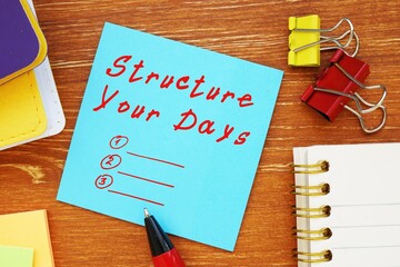 Motivation concept about Structure Your Days with phrase on the page.