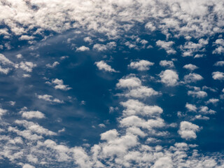Blue sky background with white clouds.