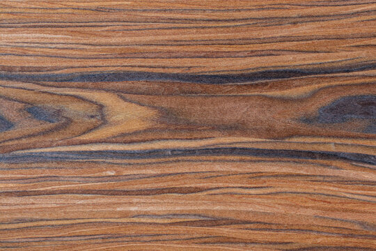 Holz Hintergrund von einem Santos Palisander Brett