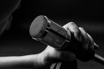 Hand and microphone