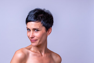 Fototapeta premium Happy friendly young woman with bare shoulders