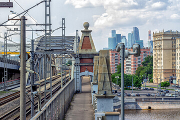 Industrial urban landscape with railway bridge, residential buildings and skyscrapers &laquo;Moscow City&raquo;