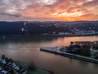 Colorful Sunrise burning sky Koblenz City historic monument German Corner where river rhine and...