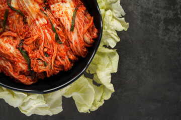 Cabbage kimchi in a bowl. - obrazy, fototapety, plakaty