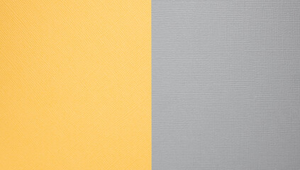 Fototapeta premium Two-color paper background. The background is yellow and grey, divided equally.