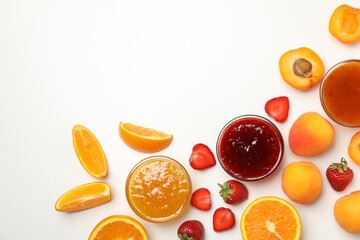 Composition with jam and ingredients on white background, top view