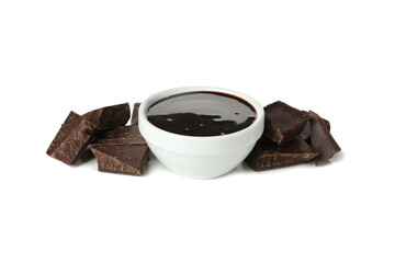 Melted chocolate and chocolate pieces isolated on white background