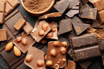 Chocolate, melted chocolate and almond on black background