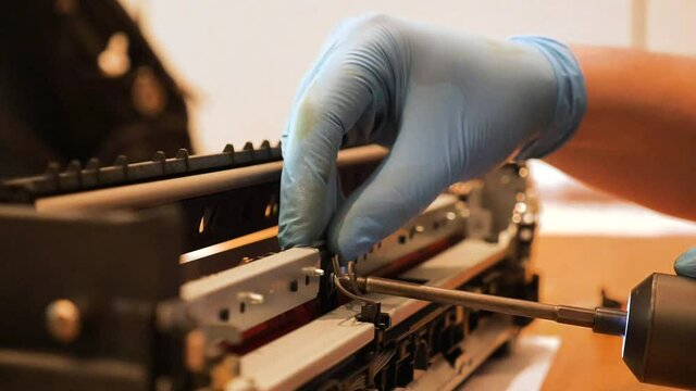 Voltmeter in the car - automotive electrician checks electro relay in the car, small business - auto garage service