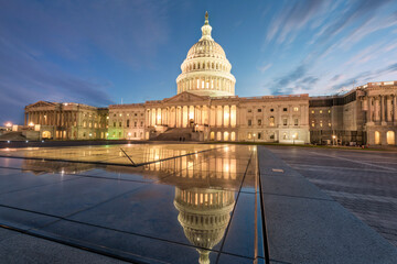 United States Capitol building at twilight with reflections