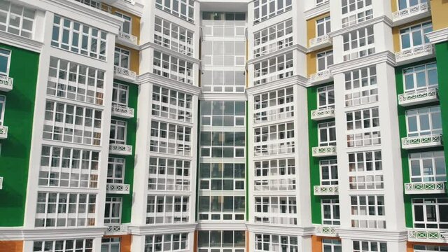 renovated multi-storey building of green white colors aerial