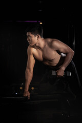 Fototapeta na wymiar muscular young man posing in studio