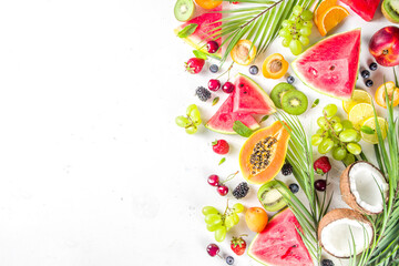 Assorted different summer tropical fresh raw fruits and berries. Clean eating, healthy lifestyle, diet and vitamin concept. 