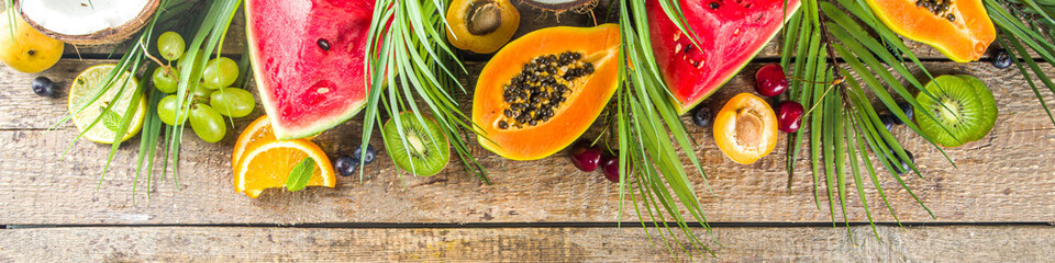 Assorted different summer tropical fresh raw fruits and berries. Clean eating, healthy lifestyle, diet and vitamin concept. 