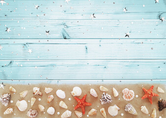 Composition of many exotic seashells different shape, red starfish, pearls, confetti, stars on the sand. Summer marine concept on a blue wooden background. Flat lay, top view, close up, copy space - Powered by Adobe