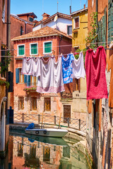 Canal and drying linen outdoor in Venice
