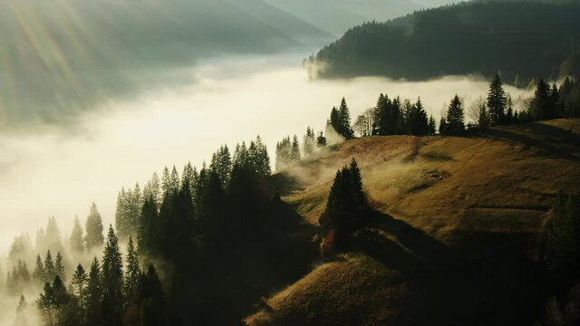 Amazing mountain landscape with fog and a haystack