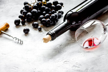 Glass of red wine and bottle on white background