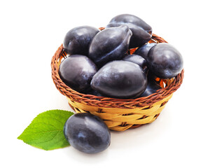 Group of plums in the basket.