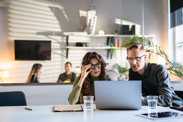 In Creative Office Productive Coworkers Standing at the Table, Company Meeting. Businessman And...