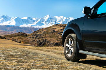 Fototapeta na wymiar Suv On The Nature In Mountains. Travel concept with big 4x4 car.