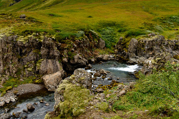 Klifbrekkufossar, beautiful row of waterfalls, in Mjoifjordur village, Iceland