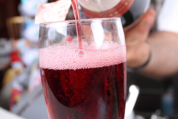 cocktail aperitif at the bar: close-up on the glass