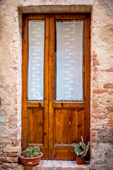 beautiful door in a street of old medieval village in Tuscany