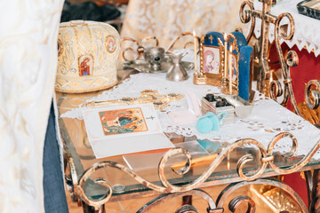 Accessories for the christening of children icons of candles, the Ortodox Church. The baptism of the baby in the church.