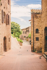 narrow old street in San Gimignano medieval Village in Tuscany 