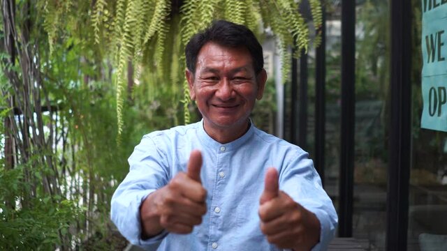 Portrait asian old man smiling and thumbs up with happiness, Elderly concept, good mood