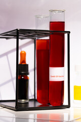 Close-up in a laboratory with test tubes with Covid-19 vaccine. High quality photo. Vial with blood.