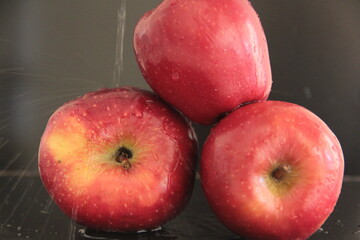 fresh and organic apples on a black background