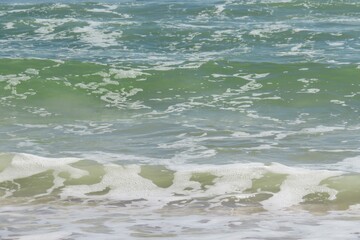 Green ocean water background on Florida beach