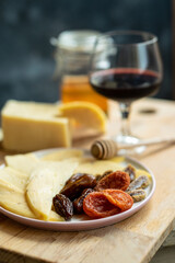 dried fruit with cheese and red wine for a snack