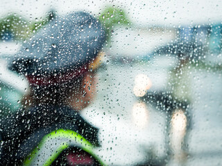 policewoman on traffic security in rainy weather