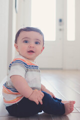 Baby playing crawling on the floor 