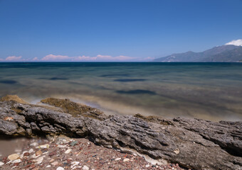 Long exposure of a rocky beach on the Mediterranean Sea, in Corsica