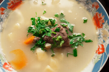 Soup with greens and meat.